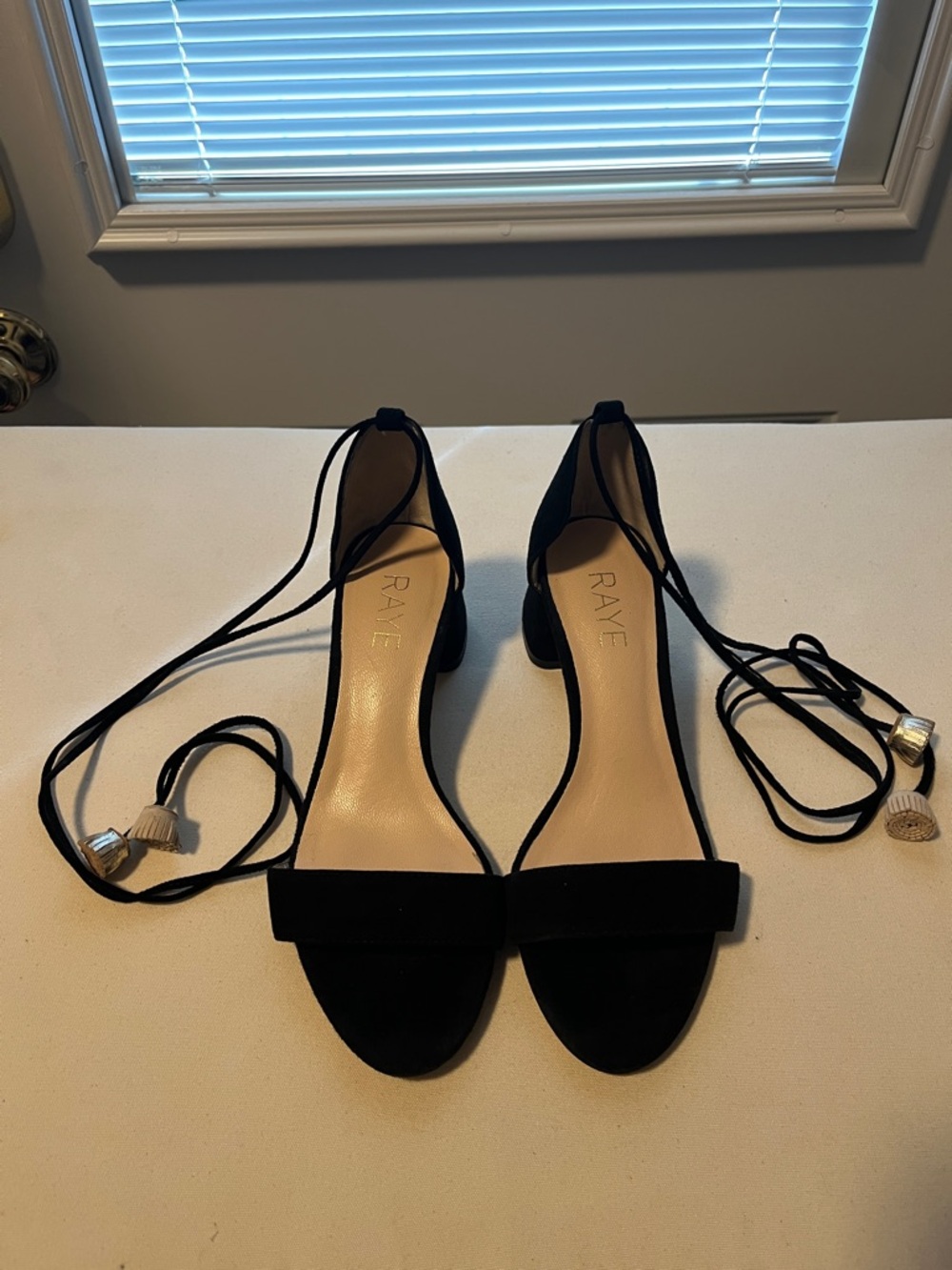 Raye wrap ankle sandals black with gold tassel